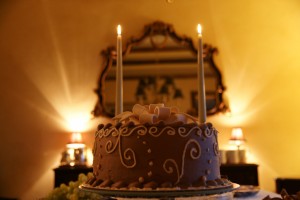 Cake in the dining room, surrounded by Italian pastries